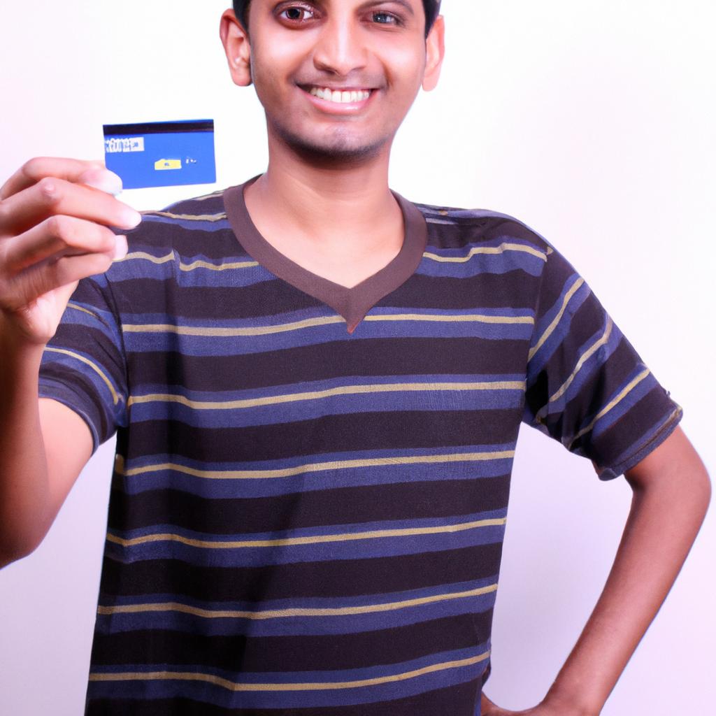 Person holding credit card, smiling